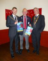 DG Richard Lees presents banners to Presidents Bob McDougall and Bill McNeill